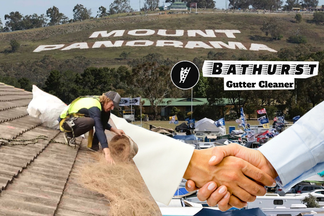 Man Cleaning Gutters in Bathurst whilst a Potential Customer is making phone calls.